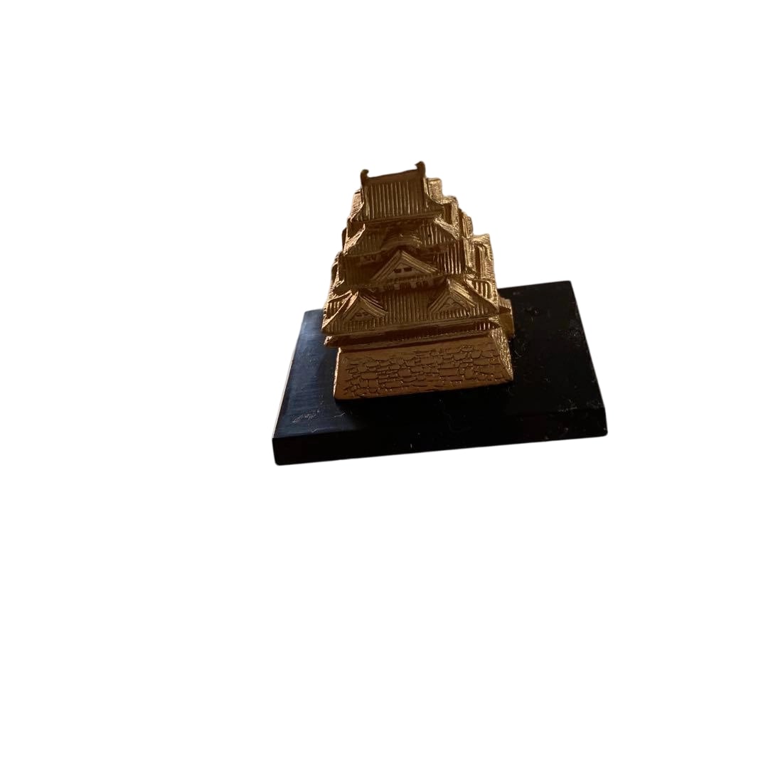 Castle motif menuki in gold sword fittings. (1 of 3)