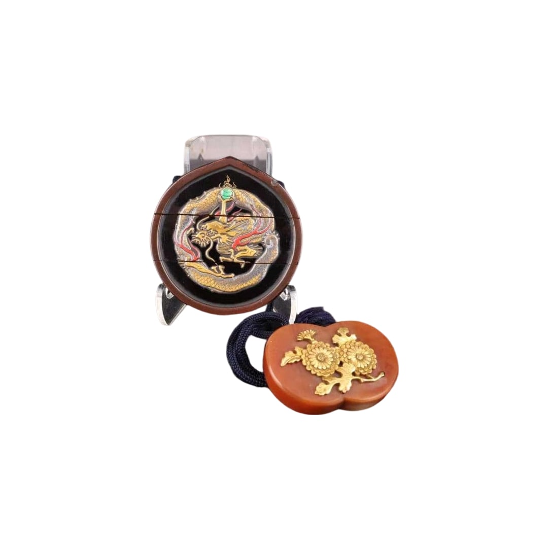 Inro: Period Lacquer Art, Gold Maki-e, Dragon Motif, Inner Nashiji, Circular Netsuke: A lacquered inro carved with dragon motifs, adorned with green gemstone embellishments. Design: Dragon carving with gold maki-e decoration Material: Lacquerware Color: Contrast of black and gold Featu