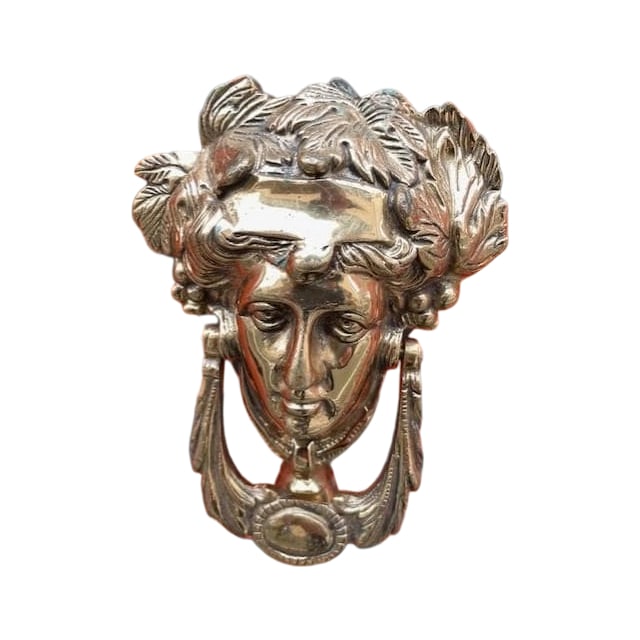 A vintage brass door knocker. (1 of 7)