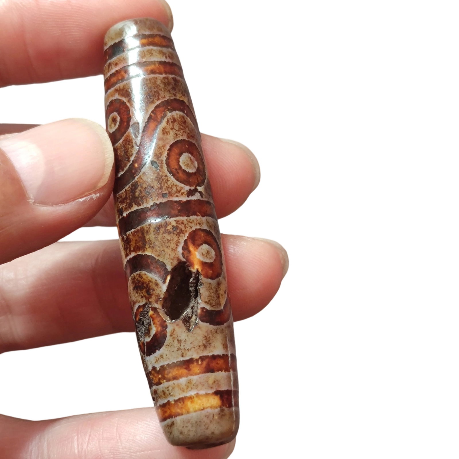 Old Dzi Bead with Eight Eyes: This old Dzi bead is renowned for its unique eight-eye pattern, with clear lines and natural patina. The bead features a medicine extraction point, adding to its historical and cultural value. It meas