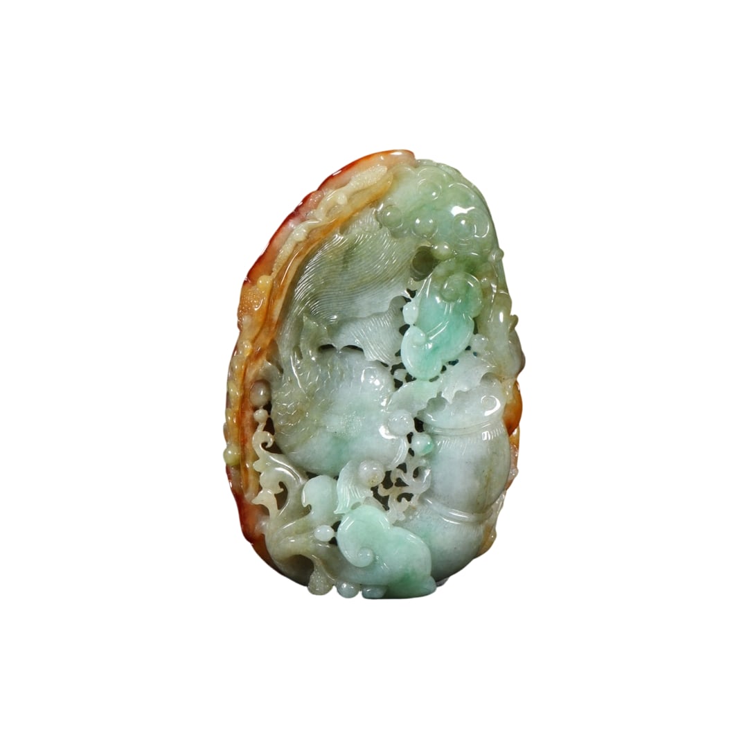 Jadeite Type A Carp 'Abundance Year After Year': This Jadeite Type A carved carp symbolizes 'Abundance Year After Year', a traditional cultural emblem of good fortune. The jadeite is of fine texture and even color, with exquisite craftsmanship,