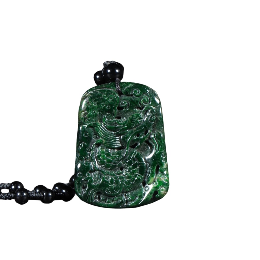 Jadeite Type A Bean Green Dragon Pendant: This Jadeite Type A Bean Green Dragon Pendant features an even color and fine texture, showcasing the natural allure of jadeite. The dragon carving is exquisite, with smooth lines and auspicious symbo