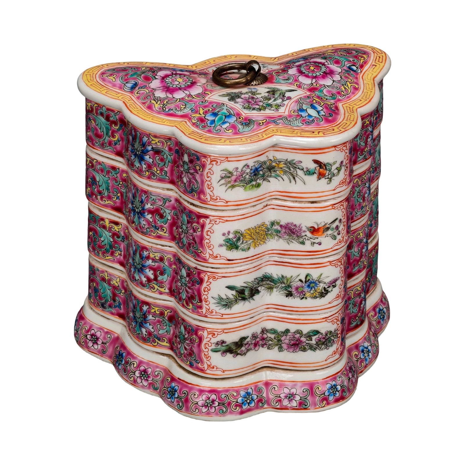 Qing Dynasty Famille Rose Windowed Floral Pattern Butterfly-shaped Multi-layer Box: This box features famille rose decoration with lotus patterns and windowed floral and bird motifs. The glaze is evenly applied, and the colors are layered with dense and orderly composition. The flowe