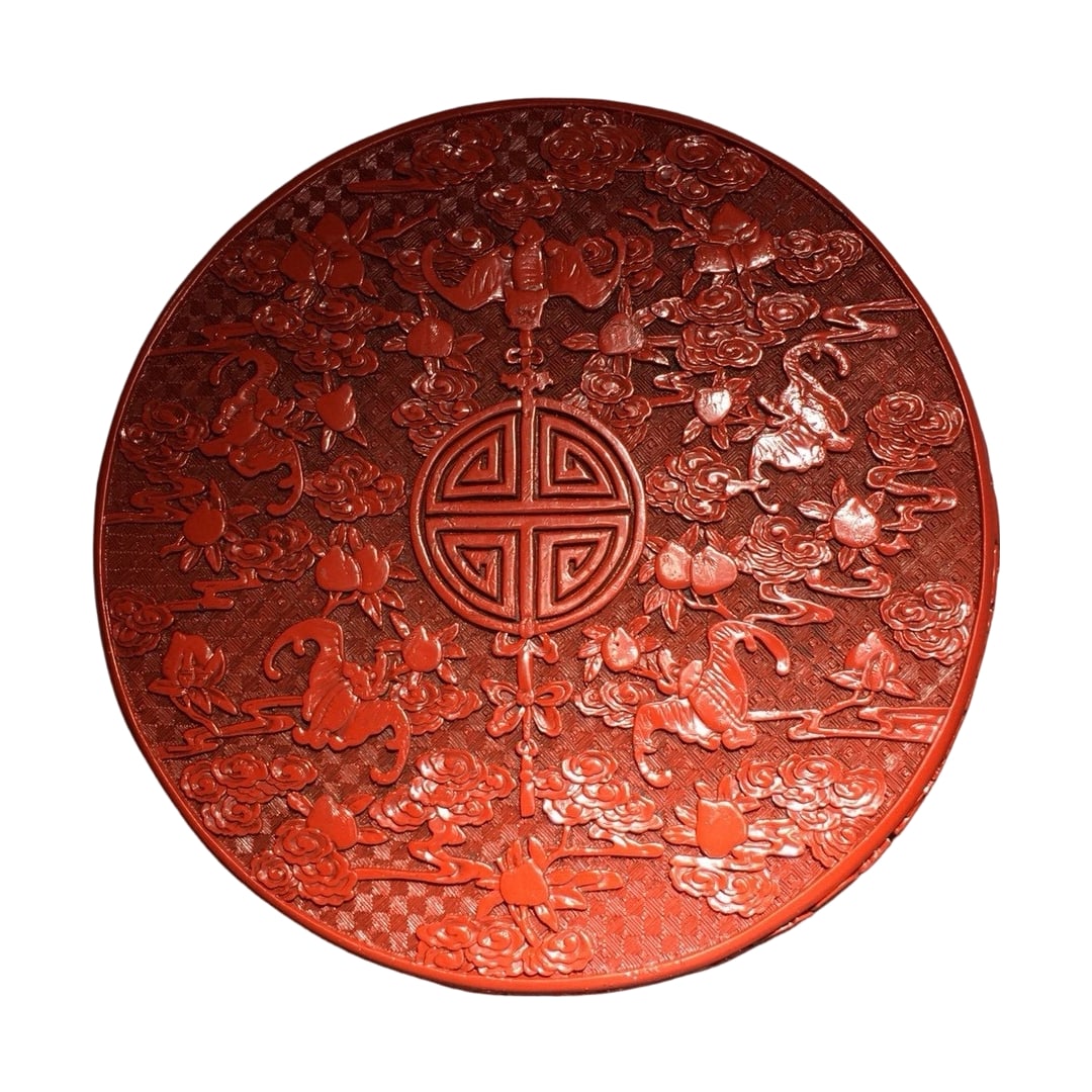 Carved Red Lacquer Box: This carved red lacquer box showcases the charm of traditional craftsmanship with its exquisite carving technique. The box features intricate carvings with distinct layers, and the lacquer is vibrant