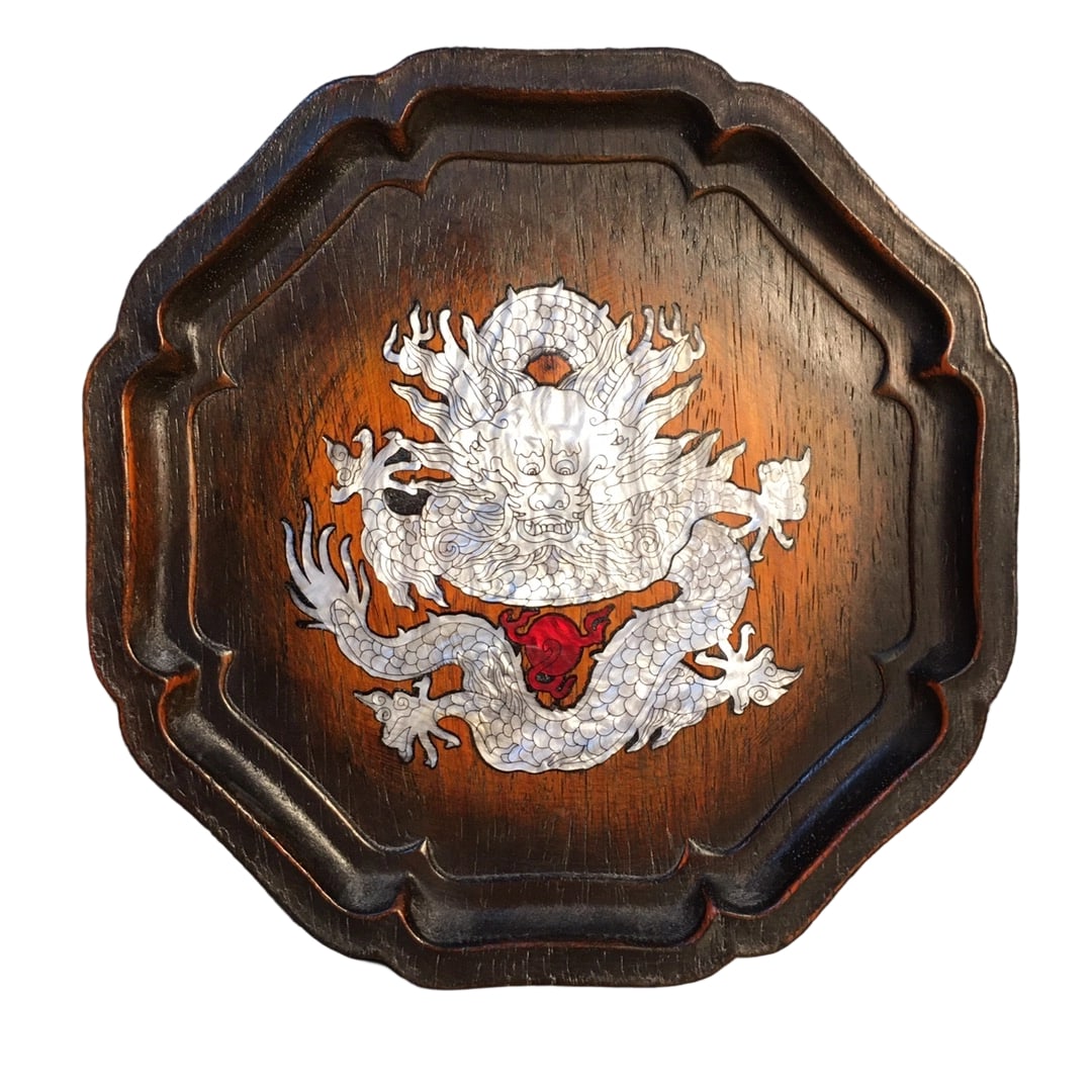 Sandalwood Inlaid with Colorful Shell Tea Tray: This tea tray is crafted from sandalwood and inlaid with colorful shells, showcasing exquisite craftsmanship with natural and smooth textures and vibrant colors. The overall design is simple yet
