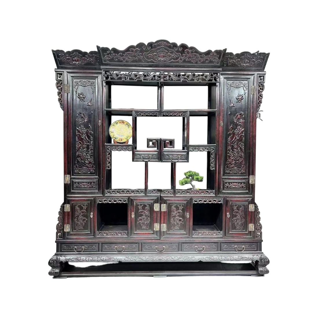 Zitan Lotus Combined Display Cabinet: This Zitan display cabinet features a lotus theme with exquisite carving craftsmanship. The lotus and seed patterns symbolize harmony and beauty. The piece is in excellent condition, showcasing the