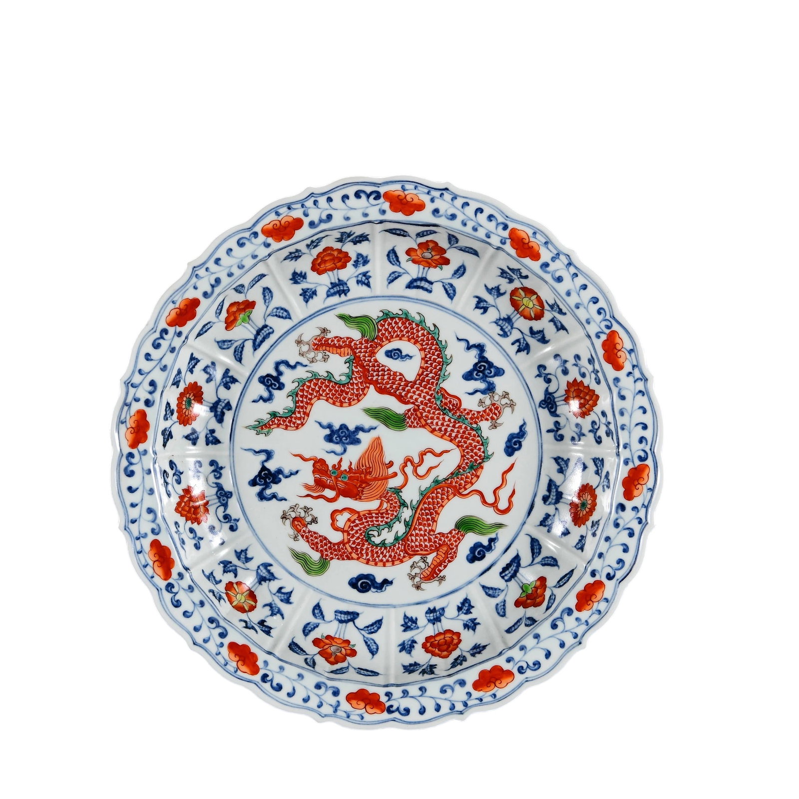 Ming Xuande Wucai Cloud and Dragon Pattern Lobed Plate: This Ming Xuande wucai cloud and dragon pattern lobed plate showcases the exquisite craftsmanship and artistic charm of Ming dynasty ceramics. The plate features a vividly colored depiction of a drago