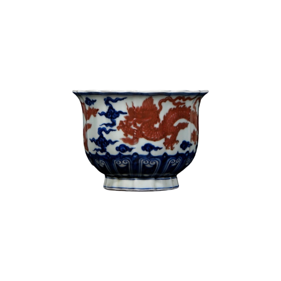 Ming Xuande Blue and Red Dragon Pattern Bowl with Carved Ridges: This bowl from the Ming Xuande period, featuring blue and red dragon patterns with carved ridges, is renowned for its exquisite craftsmanship and unique artistic style. The combination of blue and red
