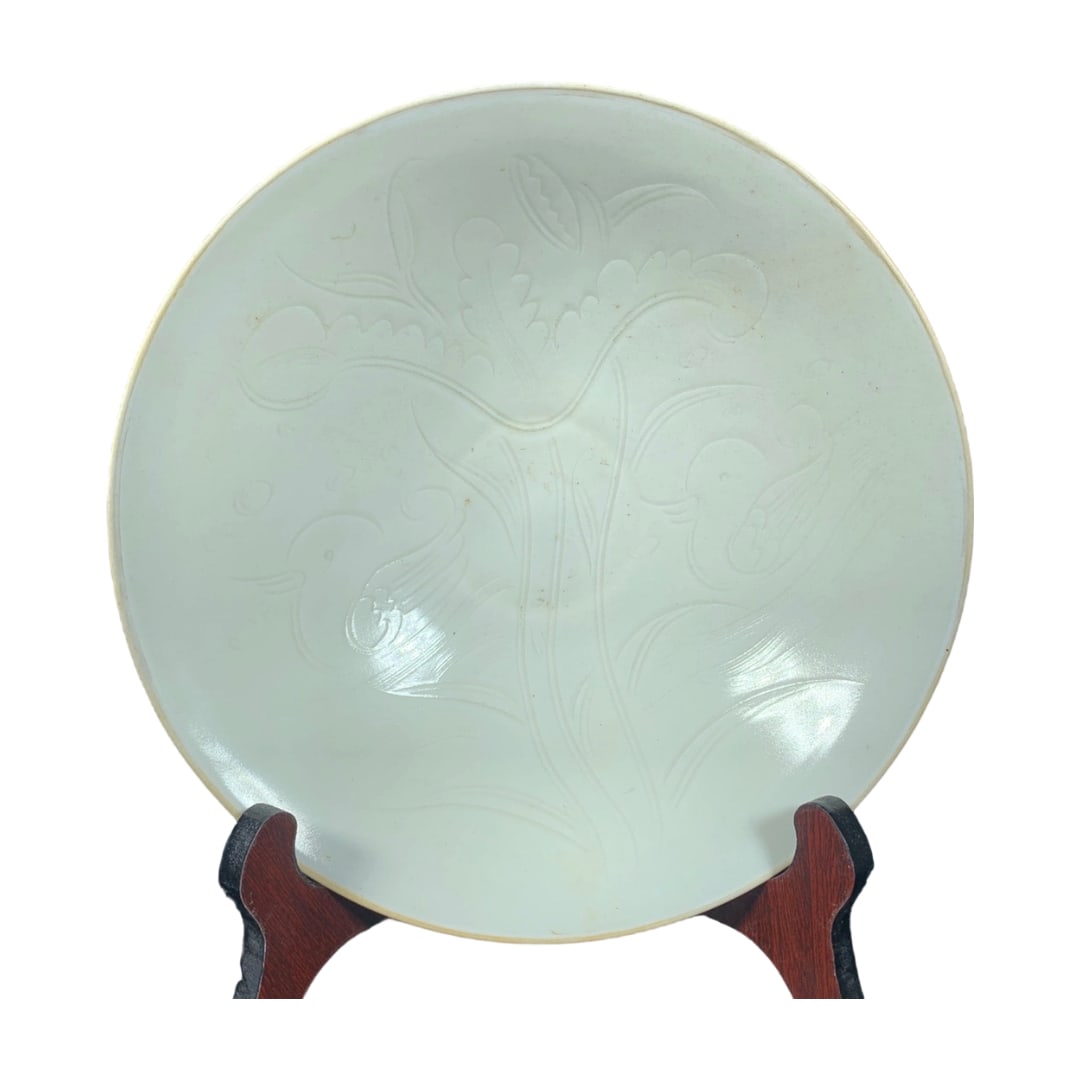 Song Dynasty Ding Kiln White Glaze Bowl with Carved Mandarin Duck Pattern: This Song Dynasty Ding kiln white glaze bowl is uniquely charming with its exquisite carved mandarin duck pattern, showcasing the superb craftsmanship of Song ceramics. The white glaze is lustrous lik
