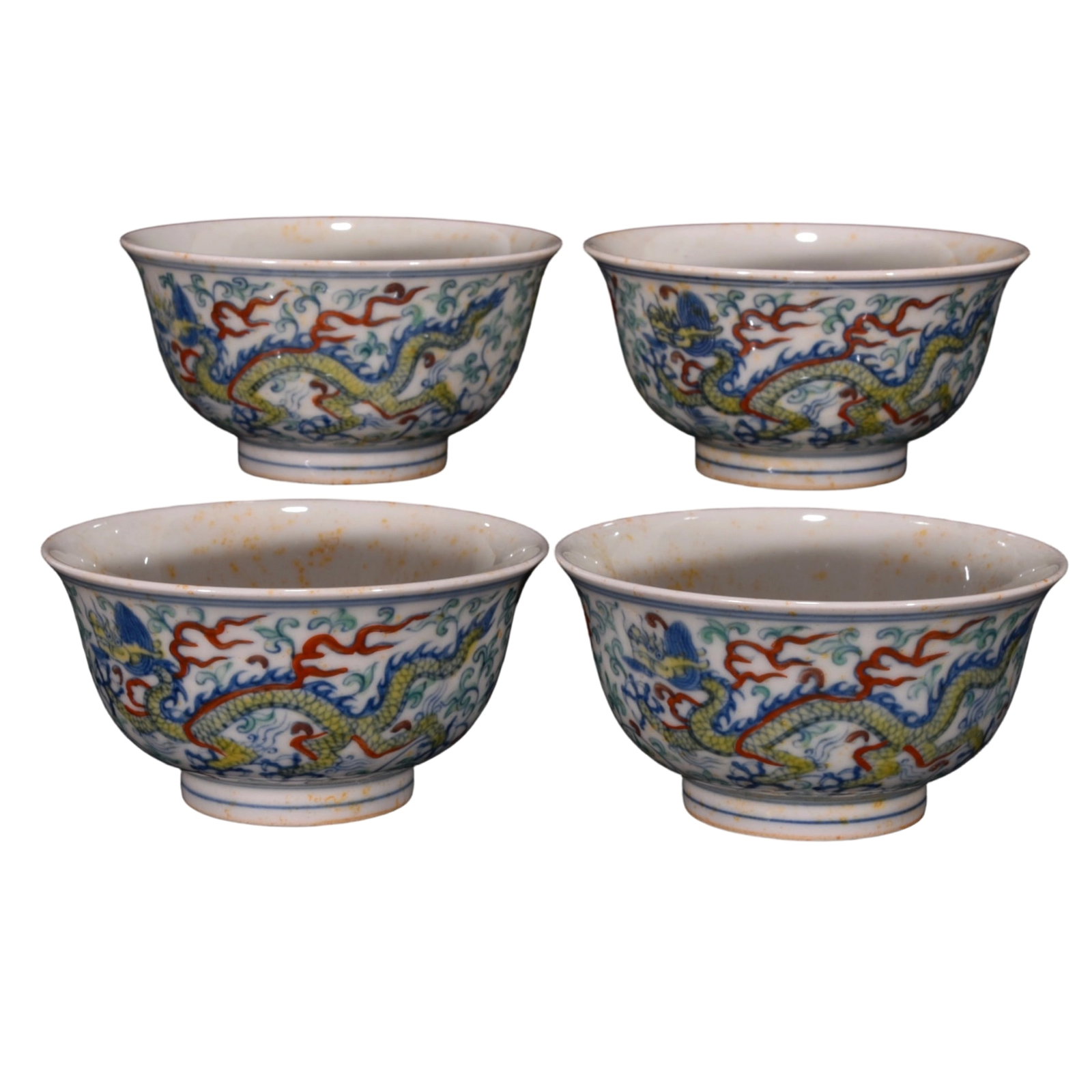 Ming Chenghua Doucai Dragon Pattern Cup: The Ming Chenghua period red-bodied doucai dragon pattern cup is renowned for its exquisite craftsmanship and unique artistic style. The cup features a red body base with intricate doucai technique, a