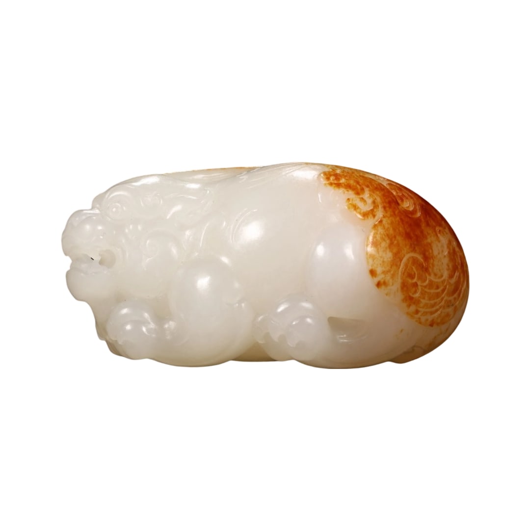 Hetian Jade Red Skin Pixiu Hand Piece: This Hetian jade Pixiu hand piece features a creamy white texture akin to suet, with a fine and oily quality, exuding a gentle and restrained luster. The skin color is rich and ancient, skillfully car