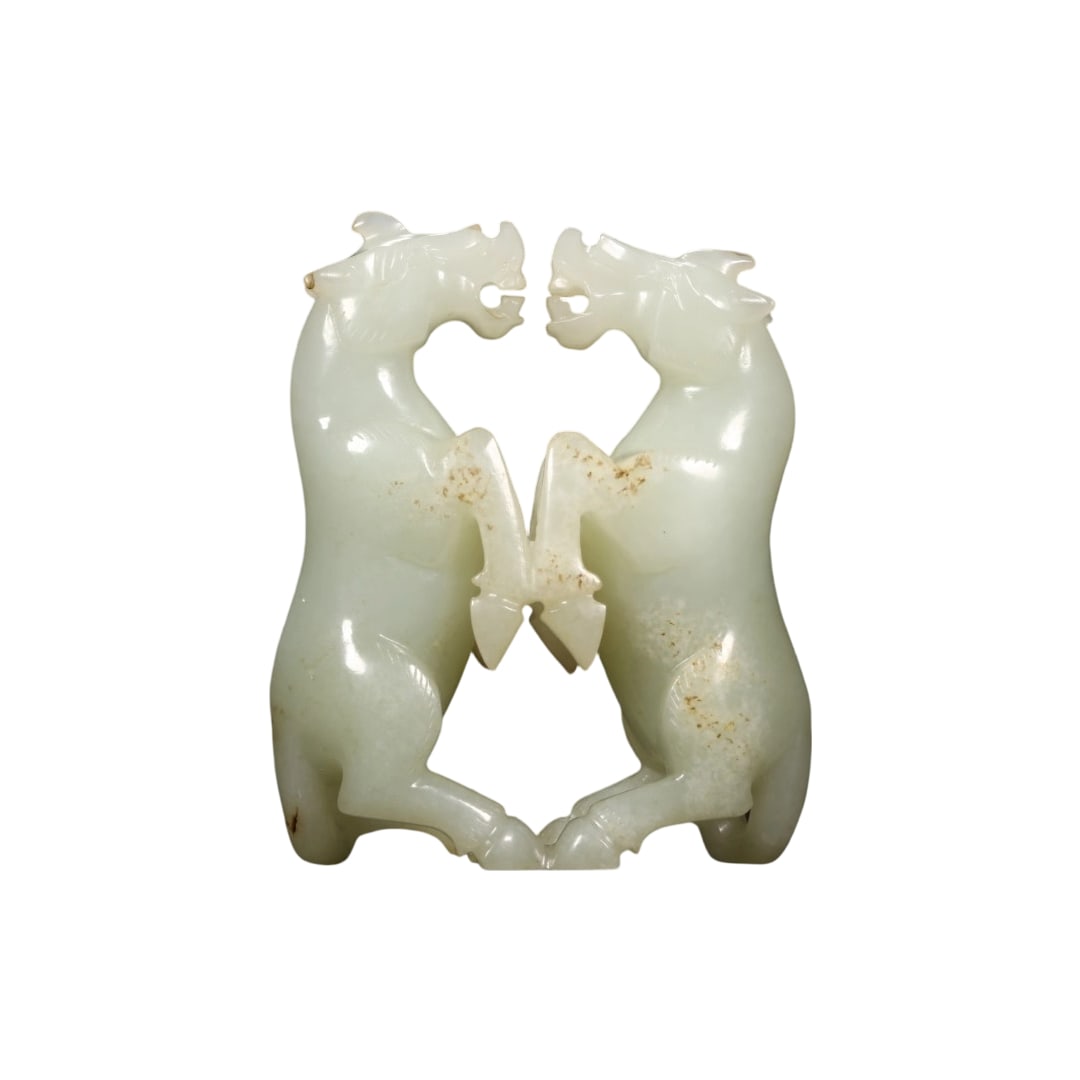 Hetian Jade Double Horse: Carved from Hetian greenish-white jade, the texture is warm and delicate with natural patina spots, exuding an ancient charm. The entire piece is intricately carved in one piece, with both horses