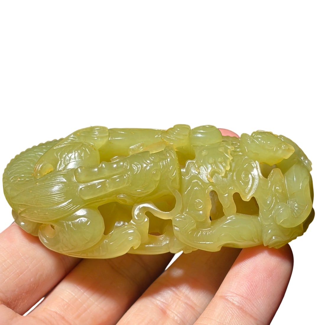 Qing Dynasty Hetian Yellow Jade 'Dragon Teaching Son': This piece of Hetian yellow jade carving depicts the classic theme of 'Dragon Teaching Son', with profound symbolism. The jade is warm and delicate, with a gentle hue and exquisite craftsmanship. The 