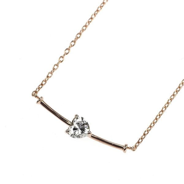 Pre-owned 18K Rose Gold Heart-shaped Diamond Pendant Necklace, 0.15 Carats: This is an elegant pendant necklace set with a sparkling diamond. In the slender rod-like design, the heart-shaped diamond is horizontally set, presenting a minimalist design style. Suitable for daily