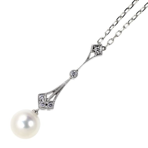 Pre-owned Mikimoto K18WG Akoya Pearl Diamond Pendant Necklace, approximately 7.6mm in diameter.: A Mikimoto pendant necklace set with Akoya pearls and diamonds, with a diameter of approximately 7.6mm. Under magnification, the pearls exhibit minor indentations and surface roughness, yet they are s