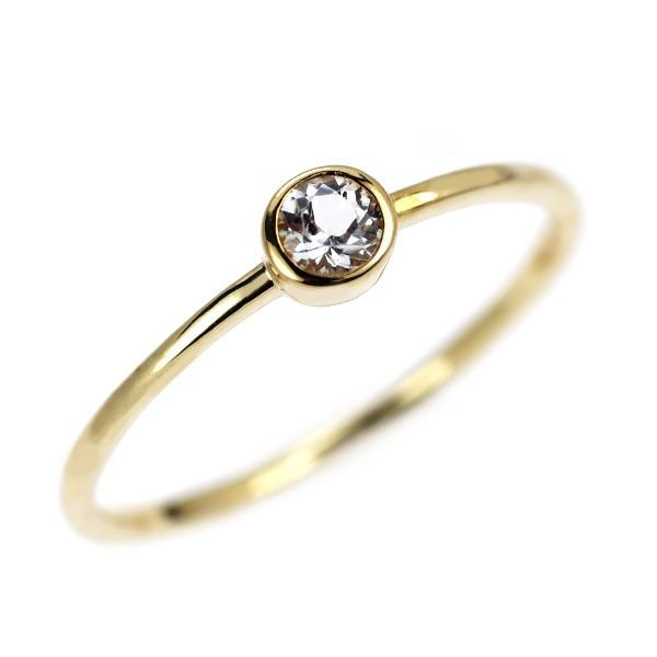 Second-hand K10YG Topaz Ring: This is a K10 yellow gold ring set with a topaz. The slender lines highlight a minimalist design, suitable for daily wear, and also recommended for stacking to add a touch of elegance. It can be combi