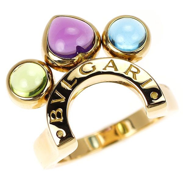 Pre-owned - Bulgari K18YG Amethyst, Blue Topaz, Peridot Ring: This Bvlgari yellow gold ring, Allegra, features vibrant colored gemstones. The center is a heart-shaped cabochon amethyst, flanked by peridot and blue topaz on either side, combining a trendy and ele