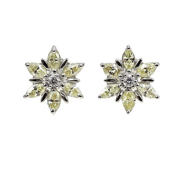 Second-hand K18WG Diamond Earrings 0.70 Carats Floral Design: This pair of platinum earrings luxuriously features a total of 0.70 carats of diamonds. The marquise-cut diamonds, shaped like petals, form an elegant floral pattern, creating a magnificent presence a