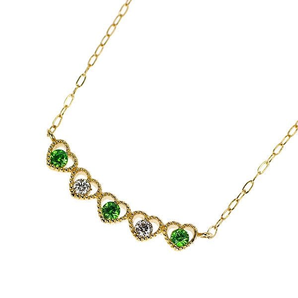 Pre-owned K18YG Demantoid Garnet and Diamond Pendant Necklace G0.07ct D0.04ct Heart-shaped: This is an elegant yellow K gold necklace inlaid with the "King of Garnets," Demantoid Garnet. Demantoid Garnet is renowned for its beautiful green hue and possesses a brilliance due to its higher dis
