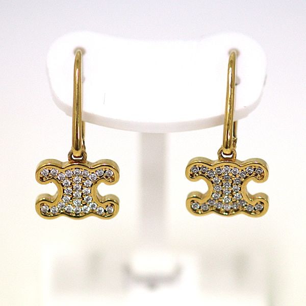 Second-hand - CELINE Triomphe Logo Earrings in Metallic Gold: Category: Branded Jewelry Brand: Celine Product Name: Triomphe Logo Earrings Model: Reference Price: Grade: A Size: Approximately 2.2 cm in height (Logo width 1 cm) Material: Metal Color: Silver Weig