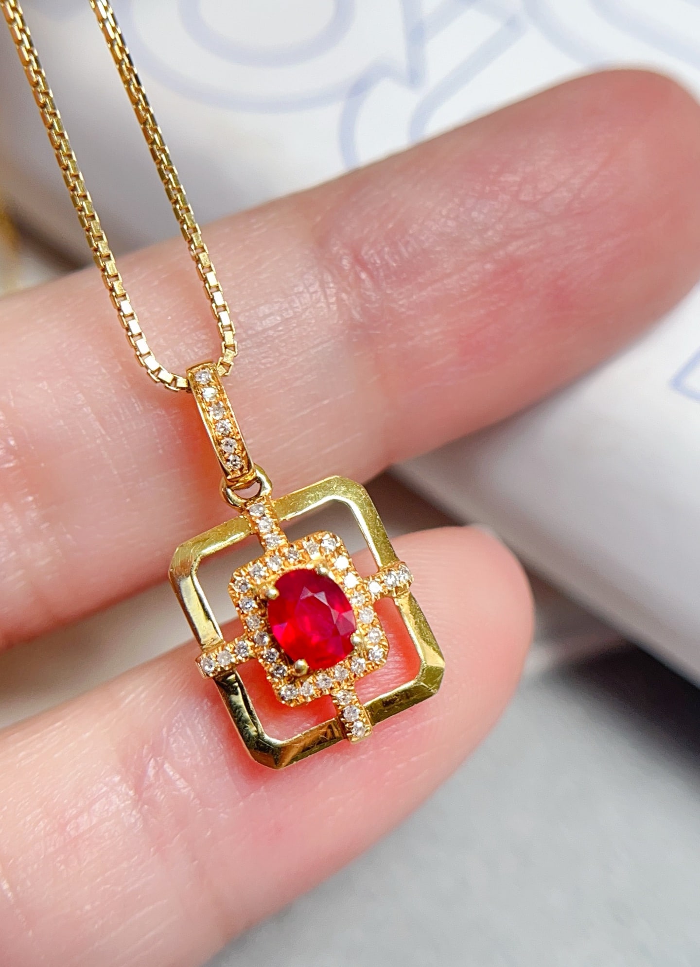18K Gold Natural Pigeon Blood Red Ruby Pendant: This pendant is meticulously crafted in 18K gold, featuring a pigeon blood red ruby that radiates captivating luster. The main stone is clean and flawless, showcasing unparalleled elegance. The