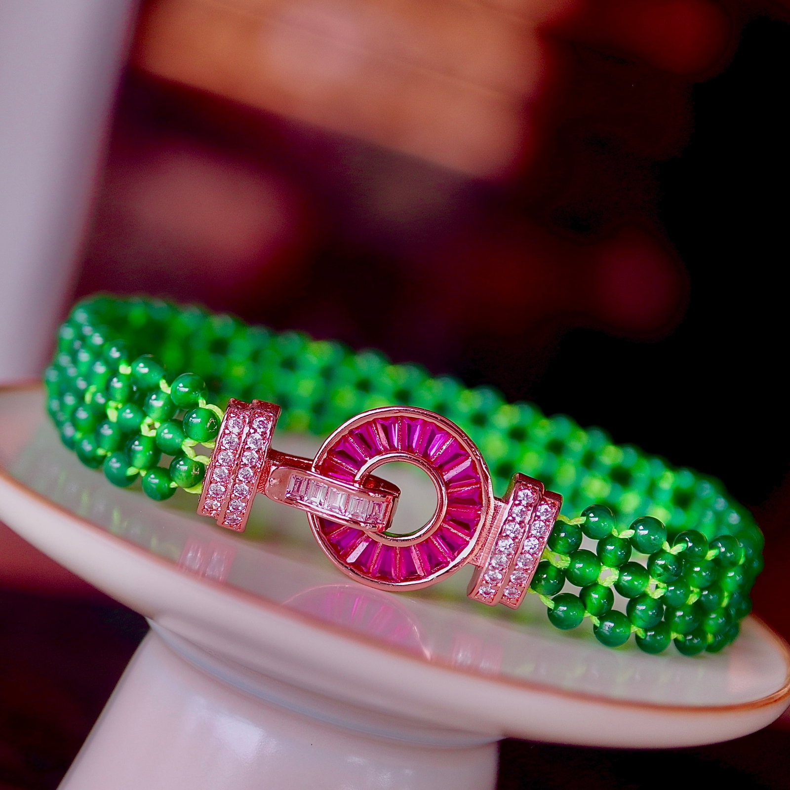 Natural A Jadeite Bracelet: This jadeite bracelet features natural A jadeite beads known for their vibrant color and handcrafted triple-strand design, showcasing unparalleled elegance and charm. It is an excellent choice for dai