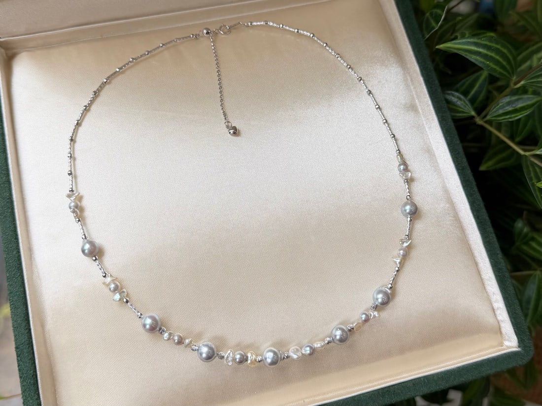 S925 Silver Natural Sea Water Pearl Necklace: This necklace is meticulously crafted from S925 silver, paired with elegant sea water pearls, showcasing a unique cool tone charm. Each pearl radiates a natural luster, perfectly blending modern and c