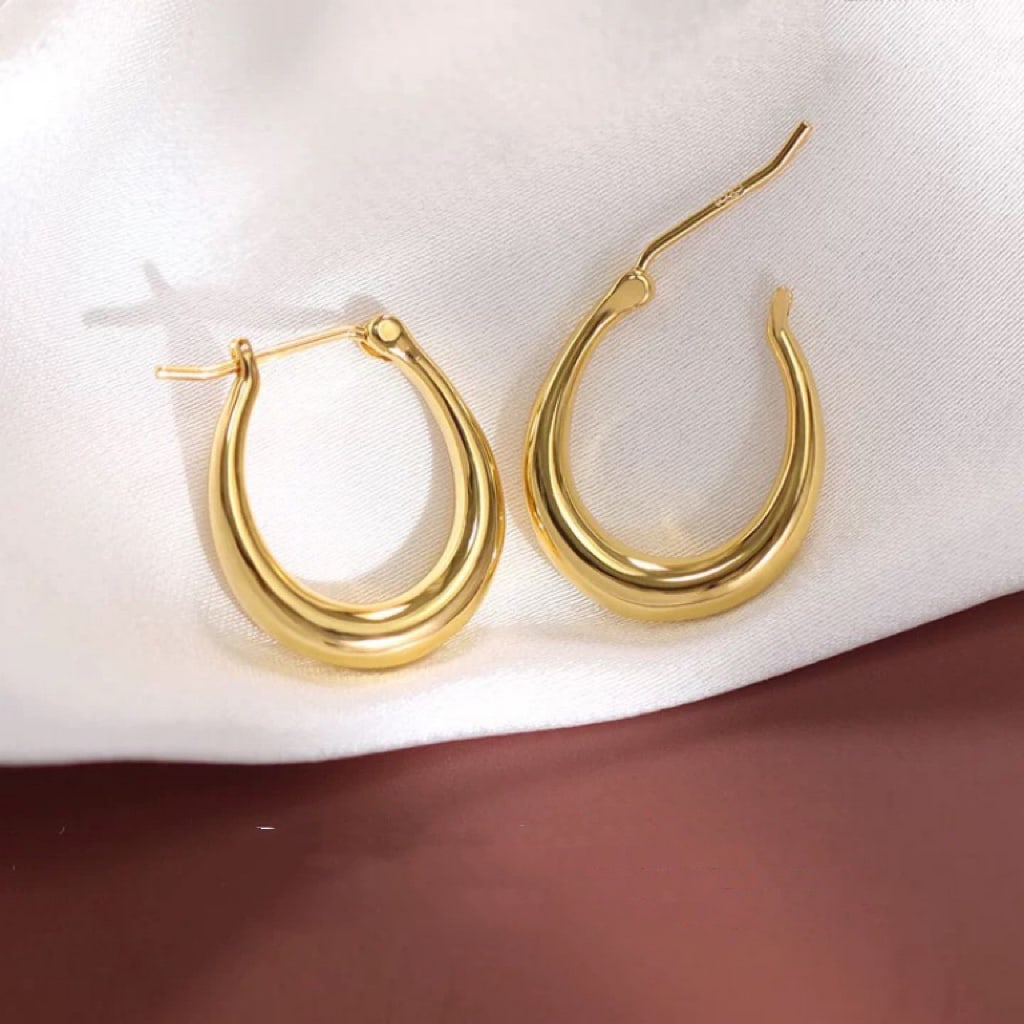 18K Gold Oval Earrings: These earrings feature a minimalist design that is lightweight and effortless, showcasing a French high-end feel, perfect for lovers of simplicity.