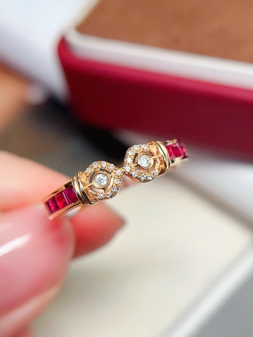 18K Gold Natural Pigeon Blood Red Ruby Ring: This ring is meticulously crafted in 18K gold, featuring a brilliant pigeon blood red ruby that exudes unparalleled elegance. The bezel setting, complemented by 20 diamonds, adds infinite sparkle and