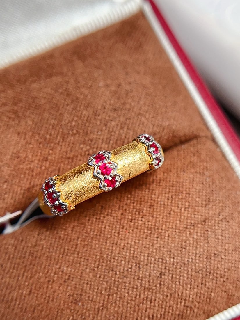 18K Gold Pigeon Blood Red Ruby Ring: This ring is crafted in 18K gold, featuring a pigeon blood red ruby that perfectly combines classic and modern styles. The brushed finish gives it a unique texture, and the wide band design adds grand
