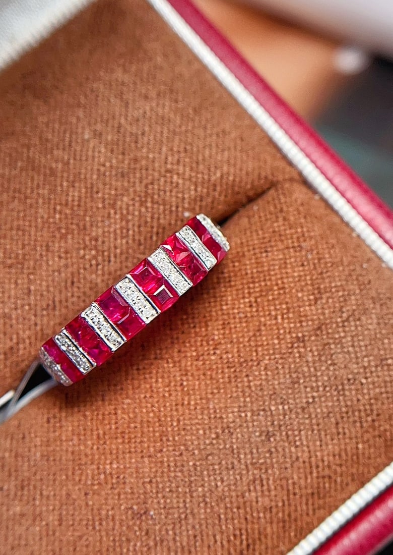 18K Gold Natural Unheated Ruby Ring: This ring is meticulously crafted in 18K gold, featuring a pigeon blood red ruby that exudes unparalleled elegance. The bezel-free setting enhances the brilliance of the ruby, complemented by 28