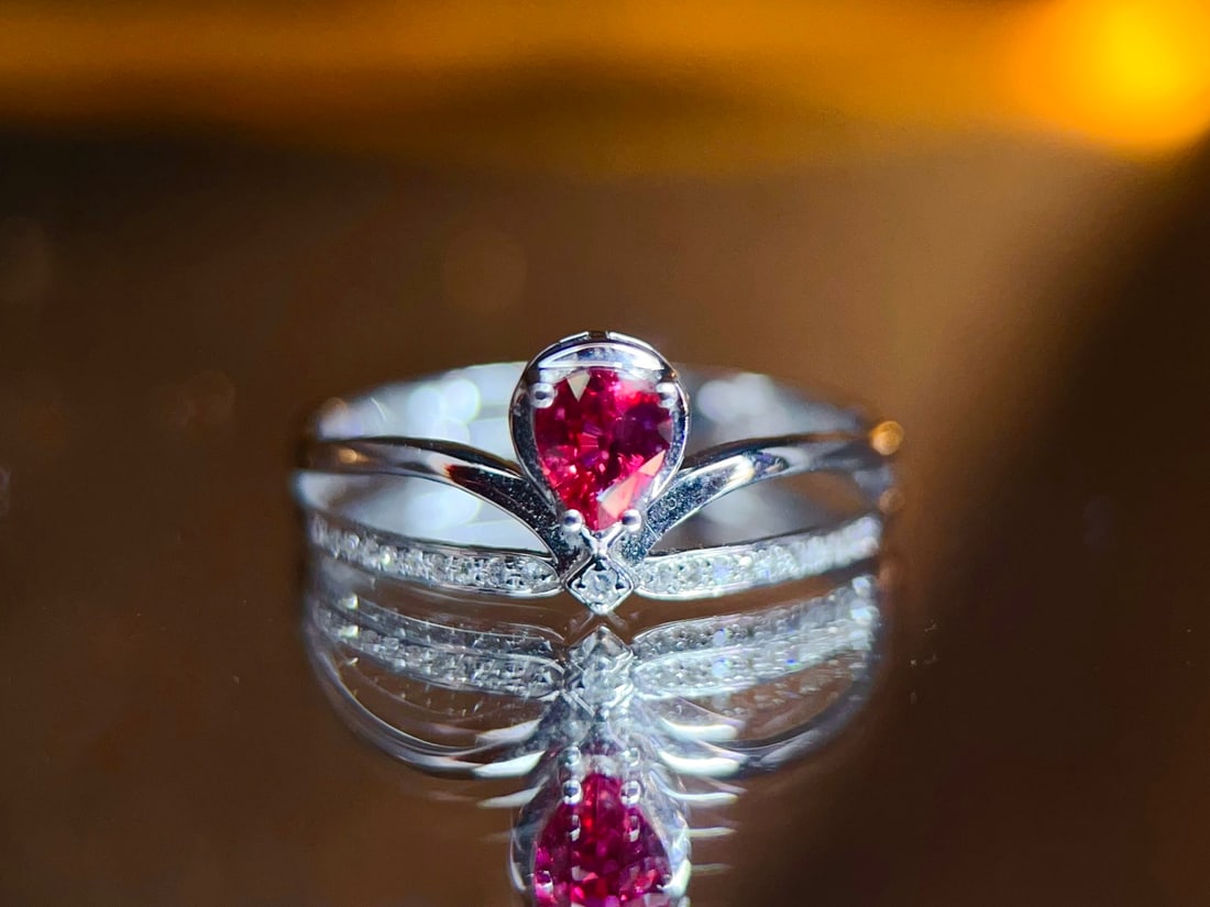 Ruby Ring: This ruby ring is renowned for its vintage style and exquisite design, perfectly showcasing a blend of classic and modern elements. The main ruby stone has a deep hue, complemented by finely set