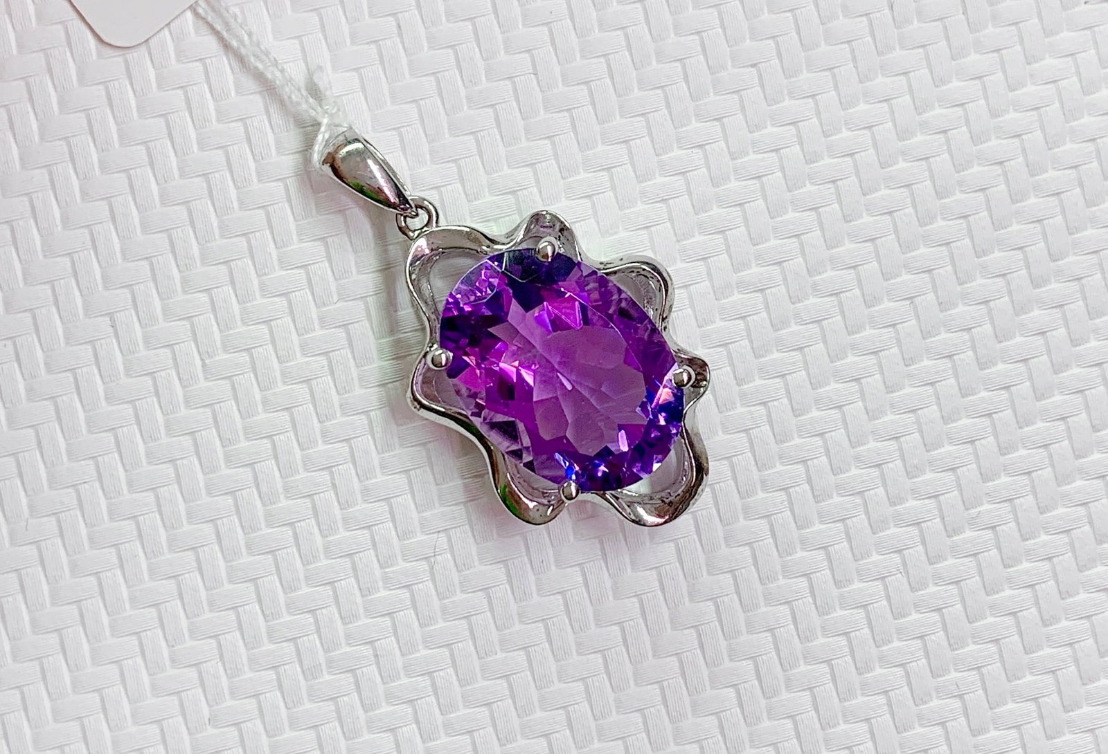 925 Silver Natural Amethyst Pendant: This pendant is meticulously set in 925 silver, showcasing the enchanting color of natural amethyst. The elegant shape of the amethyst complements the silver sheen, suitable for any occasion. The ston