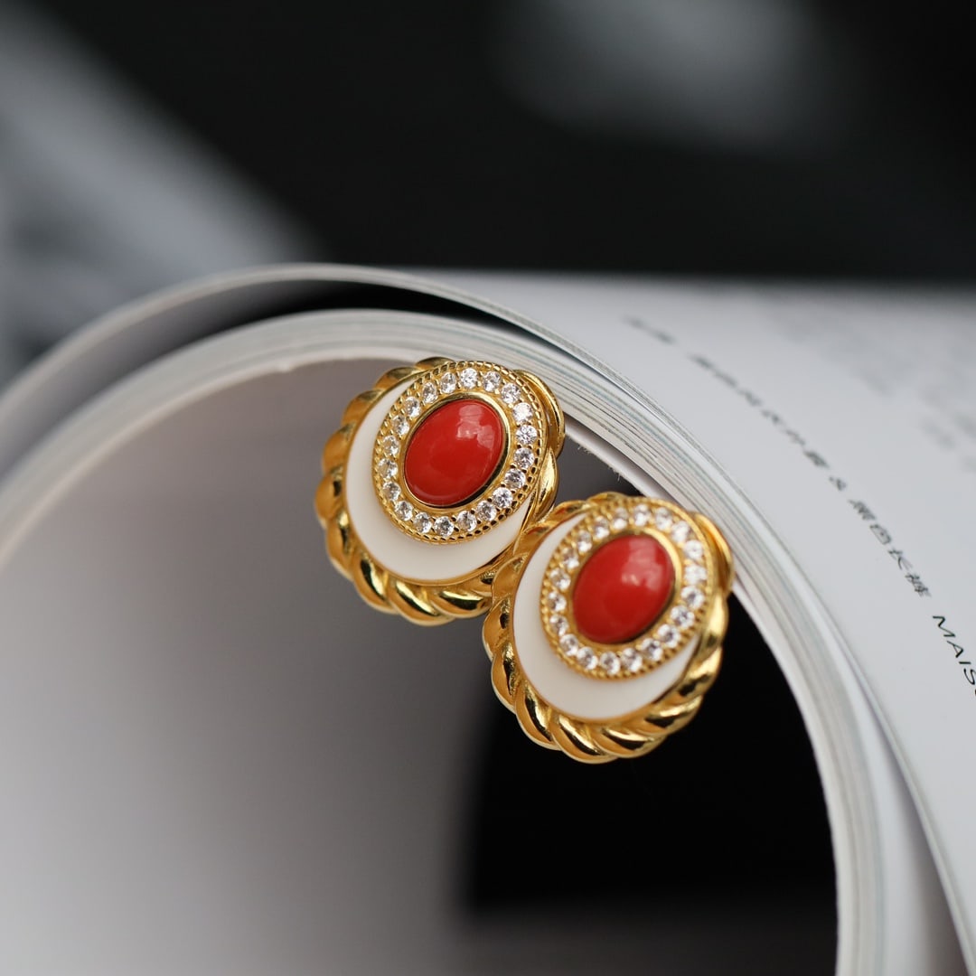 Natural Red Coral Earrings: These earrings feature natural red coral as the main stone, showcasing a simple yet elegant design. Set in S925 silver, the craftsmanship ensures lasting color and quality.