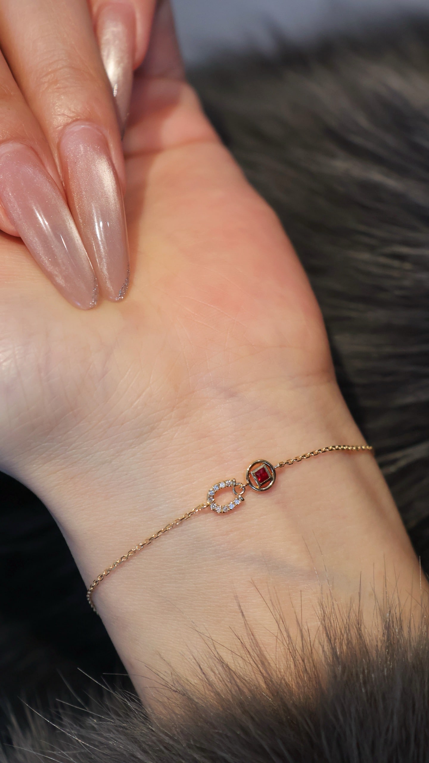 18K Gold Ruby Diamond Bracelet: This bracelet is crafted from 18K gold, set with rubies and diamonds, symbolizing luck and protection. Its exquisite design conveys a wish for prosperity and success.