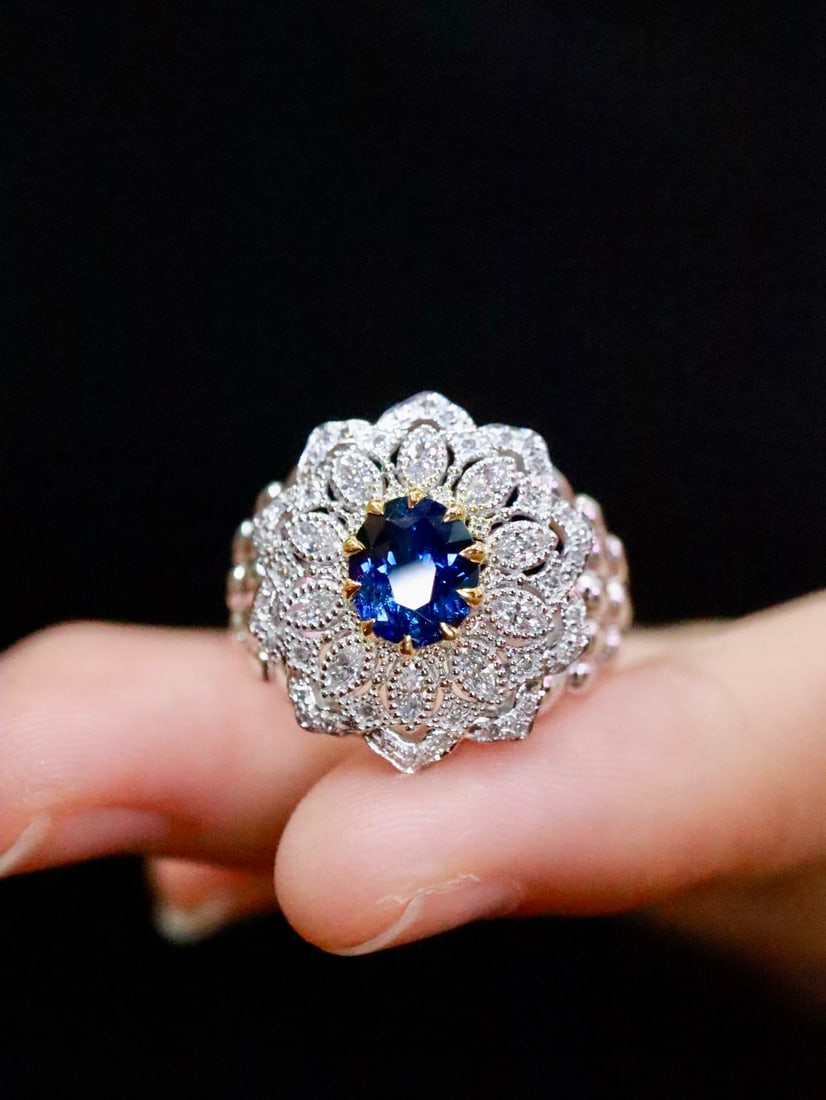 Platinum Natural Sapphire Ring: This ring perfectly combines modern and classical styles, showcasing elegant lines and exotic charm. The platinum-set sapphire complements the diamonds beautifully, making it a striking piece when wor