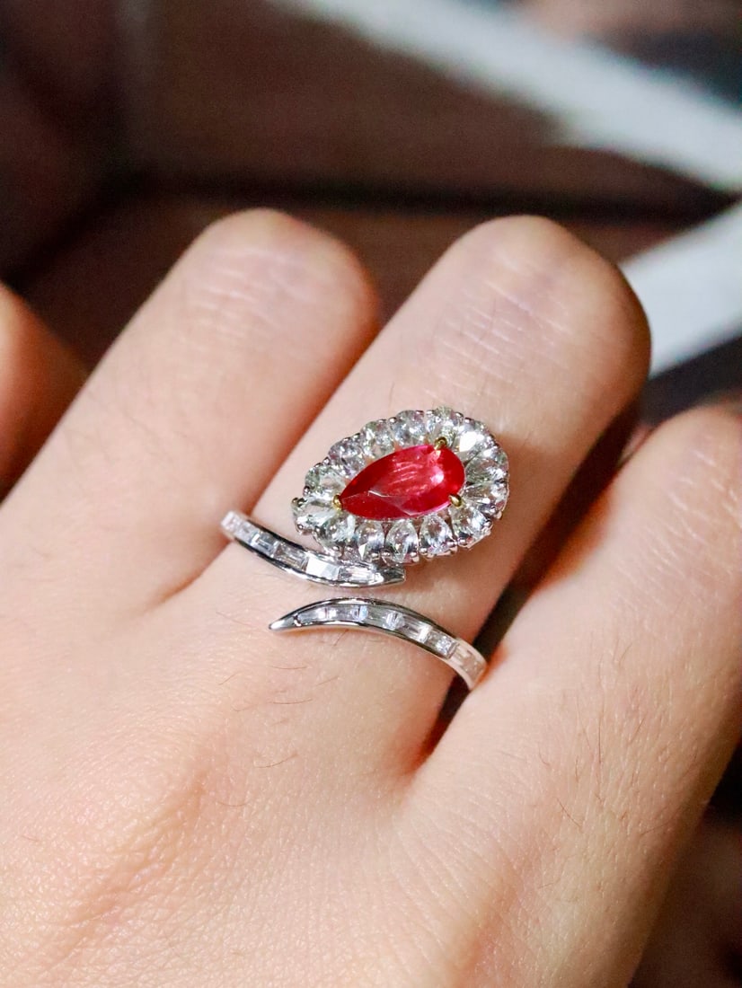 18K Gold Natural No-Heat Ruby Ring: This ruby ring captivates with its unique design and exquisite craftsmanship. The main stone is bright in color and flawless in crystal, with diamonds that sparkle brilliantly. Perfect for collectors 