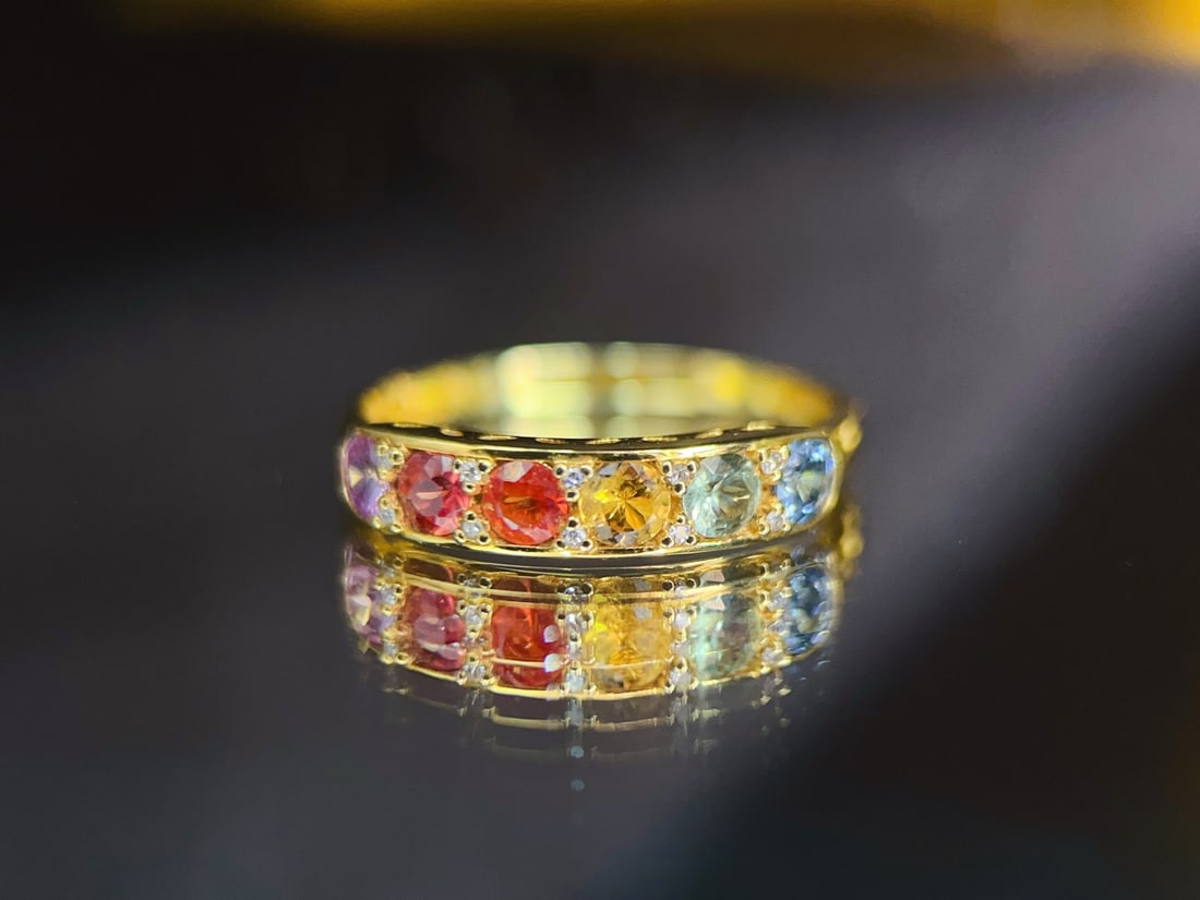 Sapphire Ring: This ring showcases the unique charm of sapphire with its vintage style and exquisite design. The brilliance of the main stone complements the diamond accents, suitable for various occasions. (Weight