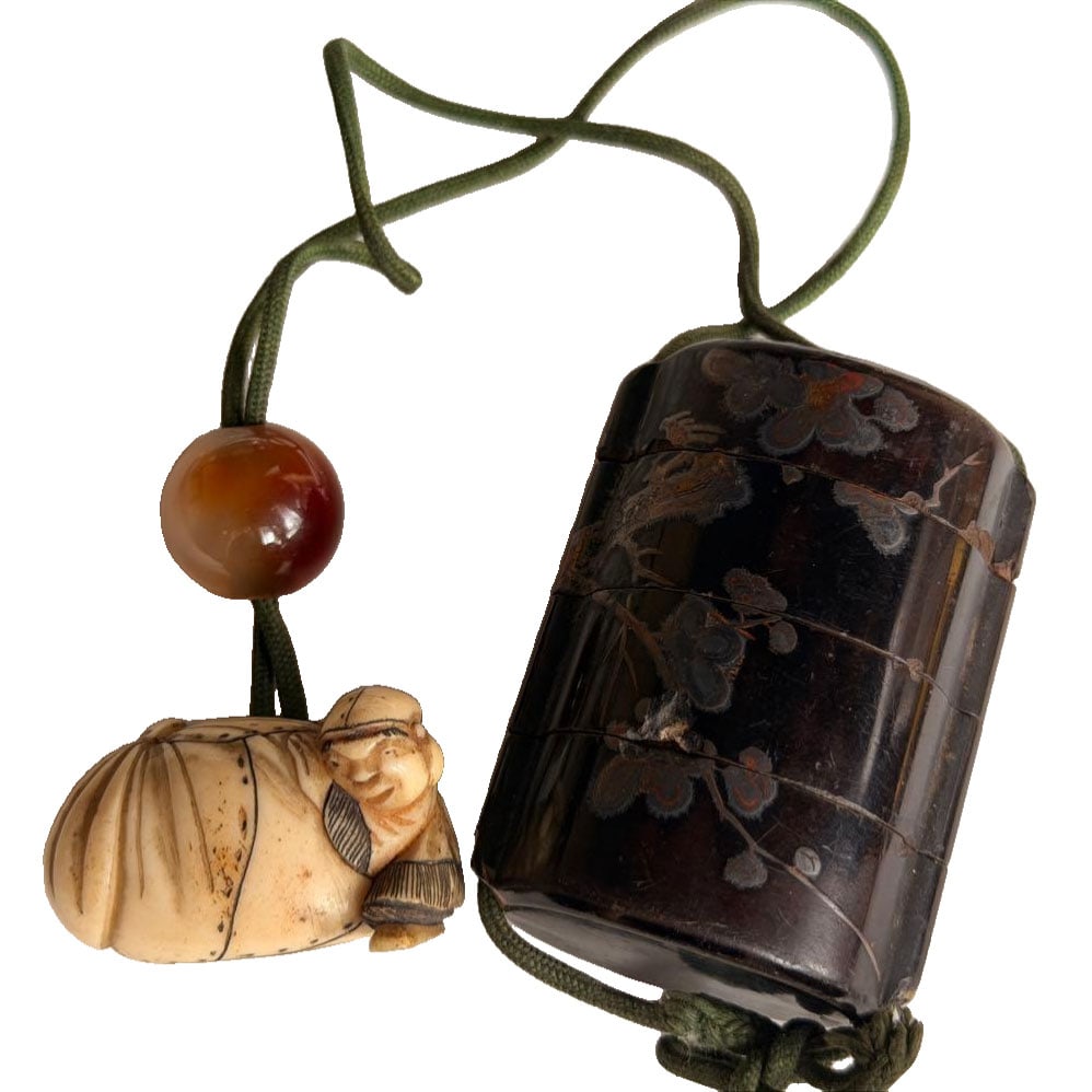 Inro with Signature and Netsuke: Signed Inro and Netsuke Signed Ikko Antique Art Inro and Netsuke. The inro section exhibits significant cracks, damage, chips, wear, and deterioration of the cord due to its age. For dimensions,