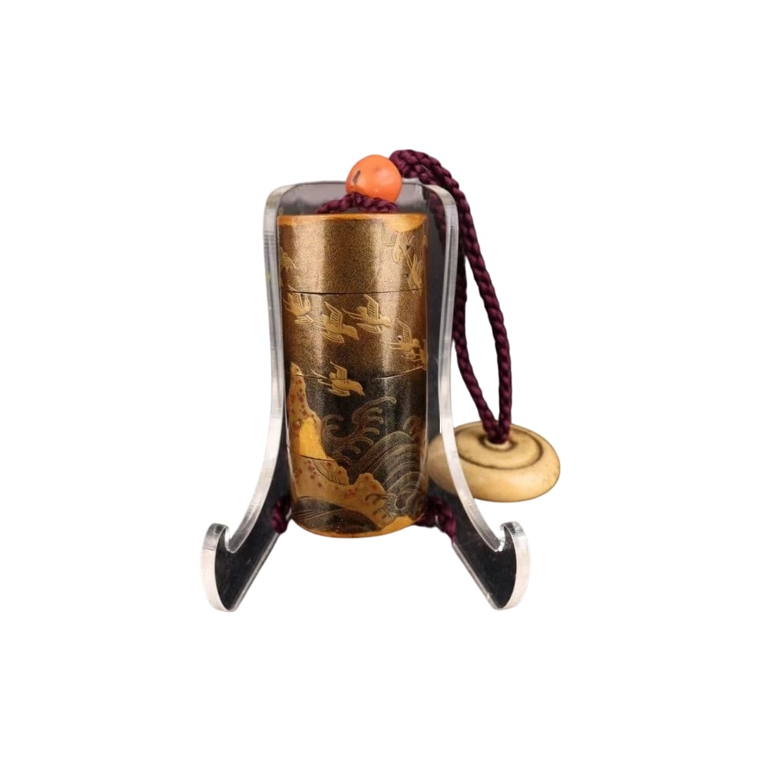 Round-shaped inro with gold maki-e decoration of waves and plovers, interior with nashiji finish,: Circular Inro with Gold Makie Waves and Plovers Design, Interior Nashiji, Netsuke, with Period Damage An inro featuring beautiful landscape paintings in gold and black lacquer. Made of lacquerware,