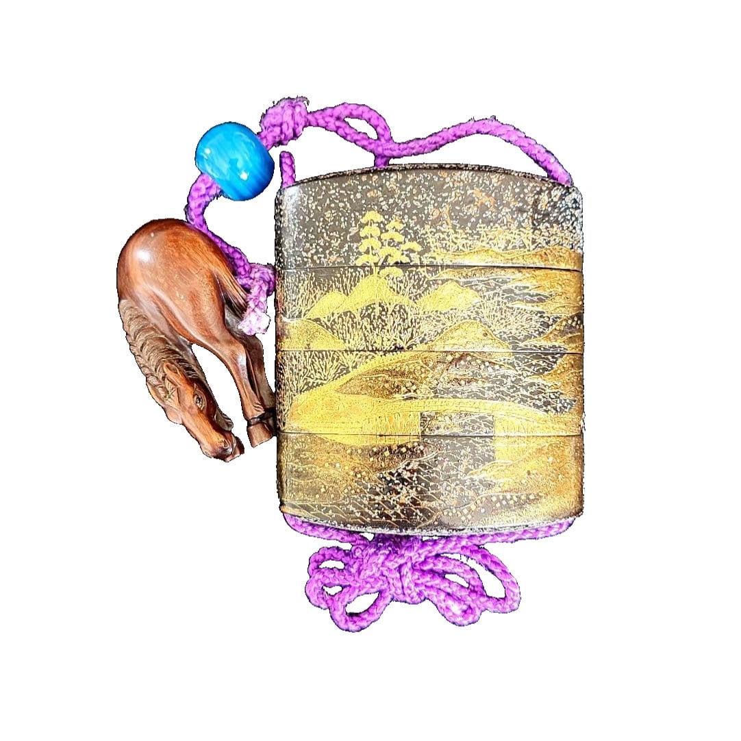 A lacquered inro with maki-e decoration, accompanied by a horse-shaped netsuke, signed "Ichisen.": Makie Inro with Horse-shaped Netsuke, Signed Ichisen, Accompanied by Wooden Box This is a makie inro depicting a landscape painting, accompanied by a finely carved horse-shaped netsuke. The decorative