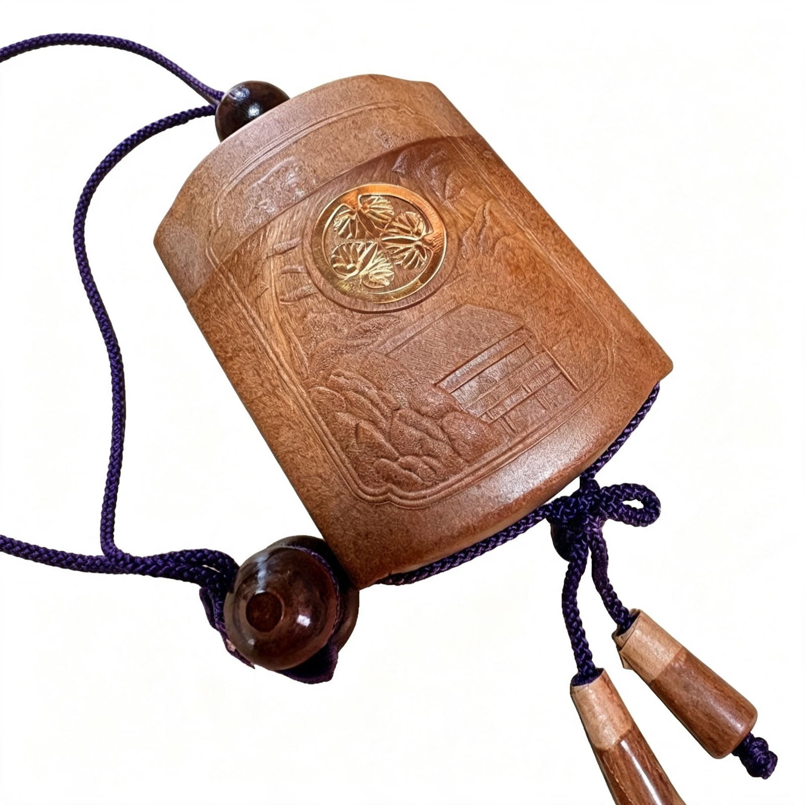 Wooden Carved Inro, Tea Color, with Purple Cord: Wooden Carved Inro, Tea Color, with Purple Cord A wooden carved inro, in tea color tone, accompanied by a purple cord, with an accessory in the form of a gourd.