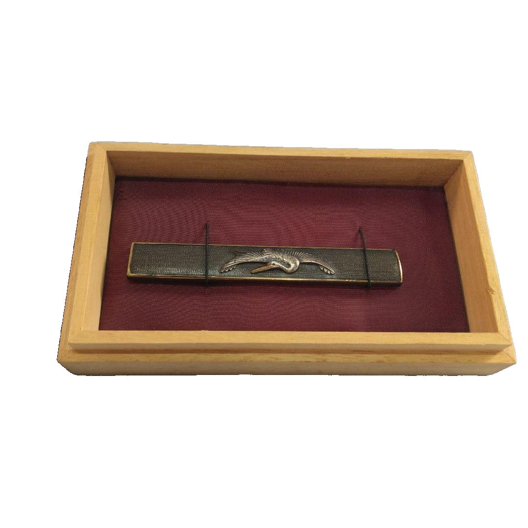 Kozuka Bukuro (Sword Fittings Pouch) with Crane Carving: Kozuka Bukuro Bugu: Carving of Cranes A metal kozuka bukuro with high relief in silver and gold depicting cranes, adorned with nanako-ji (fish roe pattern), accompanied by a wooden box. The metal