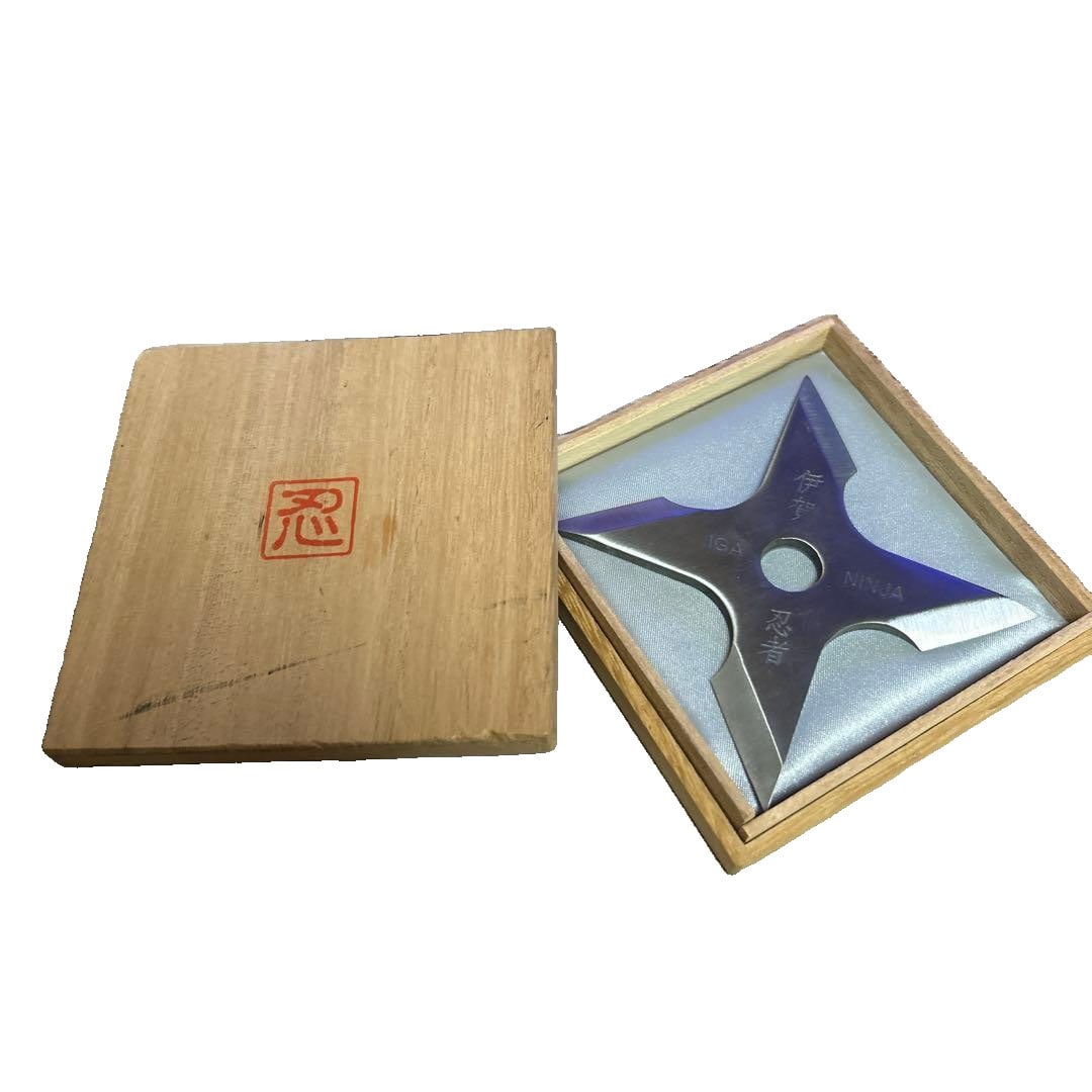 Iga Ninja Shuriken in Wooden Box: This is a square-shaped shuriken engraved with the mark of the Iga Ninja, possessing high collectible value, and comes with a dedicated wooden box. - Shape: Square Shuriken - Engraving: Iga Ninja /