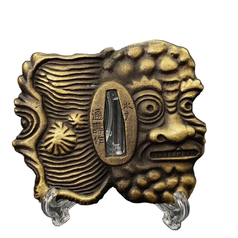 Tsuba with Depiction of Evil Spirits, Alloy, Modern Piece. Tsuba, Sword Guard, Japanese Sword: Tsuba with Oni Motif, Alloy, Modern Work Material: Alloy. Weight: Approximately 125 grams. Thickness: Approximately 5 millimeters. The item is only the tsuba; the sword stand is used for photography p