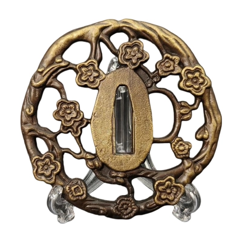 Tsuba with Cherry Blossom Design, Alloy, Modern Piece: Tsuba with Cherry Blossom Design, Alloy, Modern Piece Material: Alloy, Weight: Approximately 117 grams, Thickness: Approximately 6 millimeters. The item is only the tsuba; the sword stand is used for 