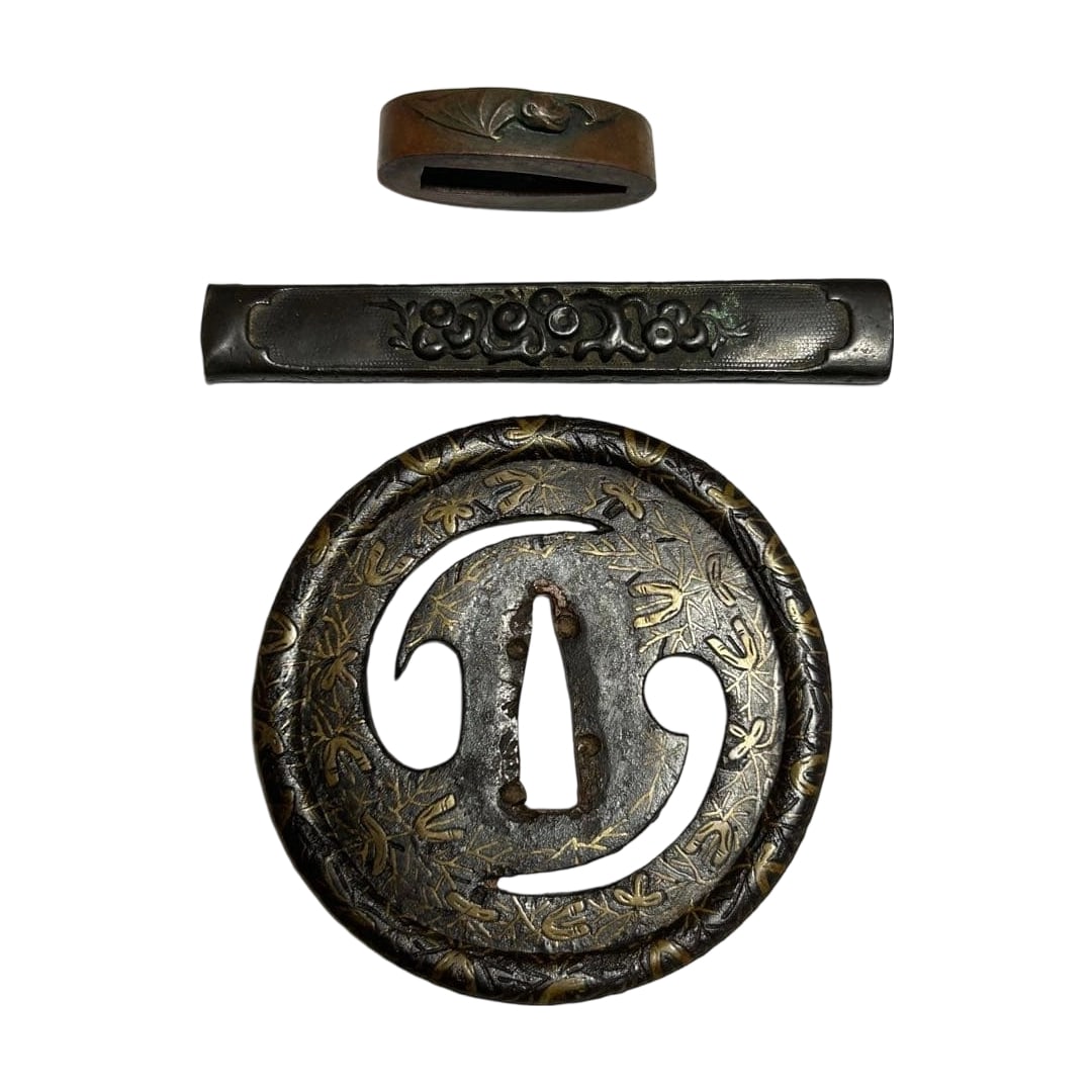 Sword Fittings: Inlay, Kashira with Bat Motif, Fuchi with Plum Blossom Motif, Kozuka.: Sword Fittings with Inlay: Tsuba with Bat Motif, Fuchi with Plum Blossom Design, Kozuka Gold Inlay Bato Tsuba: The entire piece is adorned with fine gold inlay (scattered pine needles). Tsuba with Bat