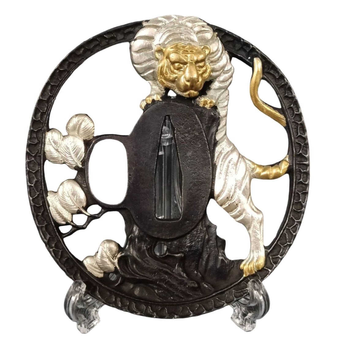 Tsuba with Ferocious Tiger Design, Bronze Base with Gold and Silver Plating, Openwork Carving: Tsuba with Ferocious Tiger Motif, Bronze Base, Gilded with Gold and Silver, Openwork Carving Material: Made of bronze, approximately 5mm thick, weighing approximately 114 grams. The item is only the t