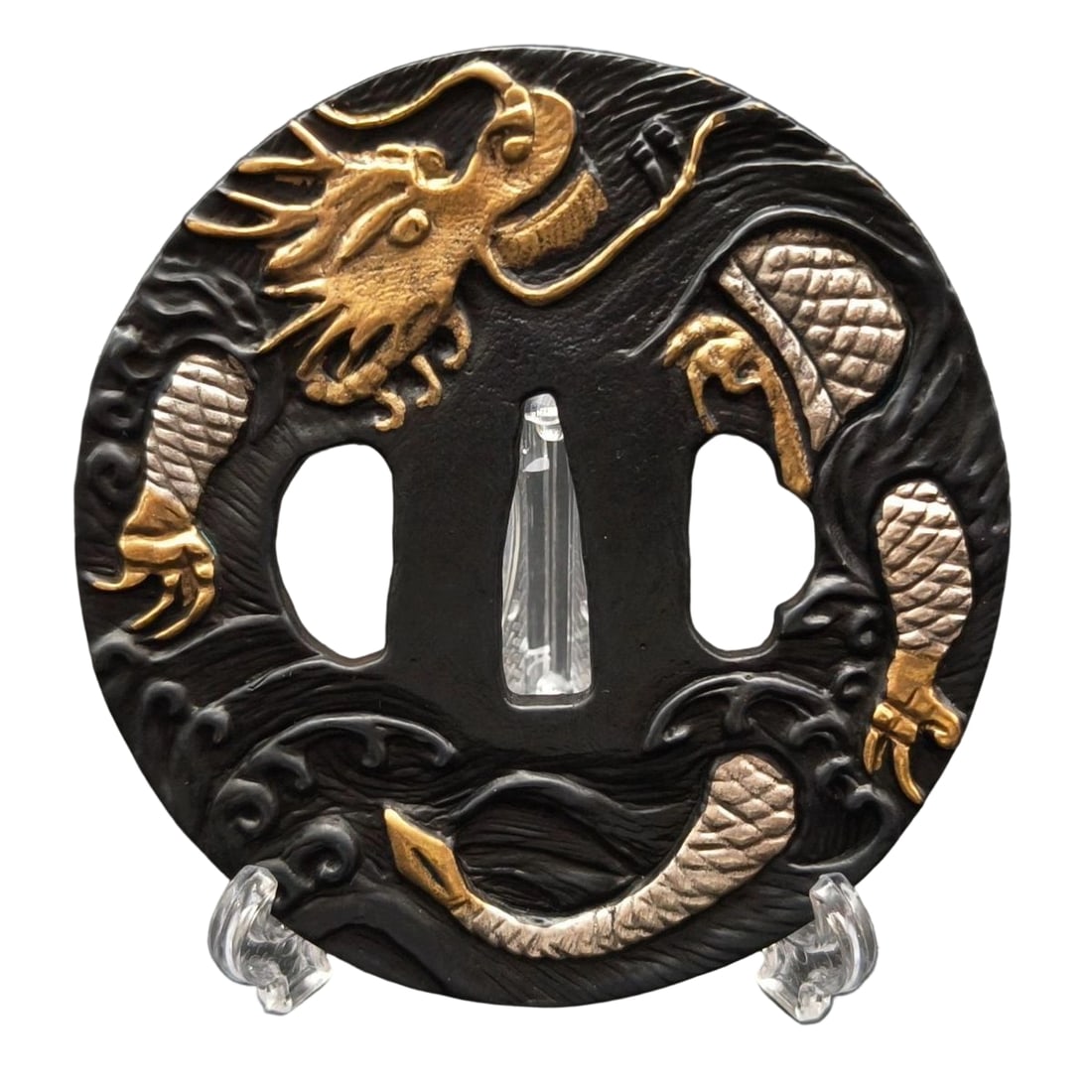 Tsuba with Sea Dragon Motif, Bronze Base, Gilt and Silver Overlay, Openwork Carving: Tsuba with Sea Dragon Motif, Bronze Base with Gold and Silver Plating, Openwork Carving Material: Bronze, Thickness: Approximately 4mm, Weight: Approximately 132g. The item is solely the tsuba; the sw