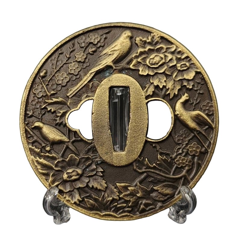 Tsuba with Peony and Bird Design, Alloy, Modern Piece: Tsuba with Peony and Bird Design, Alloy, Modern Piece Material: Alloy. Weight: Approximately 100 grams. Thickness: Approximately 4 millimeters. The item is only the tsuba; the sword stand is for photo